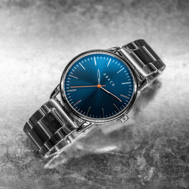 Reloj azul hombre 42mm con correa plateada y diseño minimalista moderno | Thomson | Colección Original | Ábaco